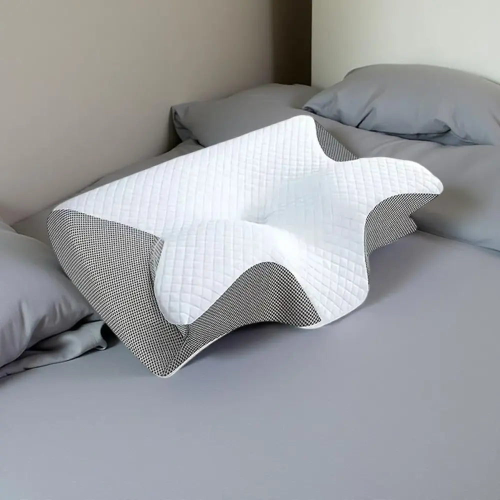 Contoured design of orthopedic pillow — cradles head and neck for perfect alignment