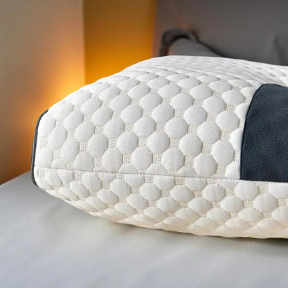Close-up of white quilted orthopedic neck pillow with contoured design for optimal support